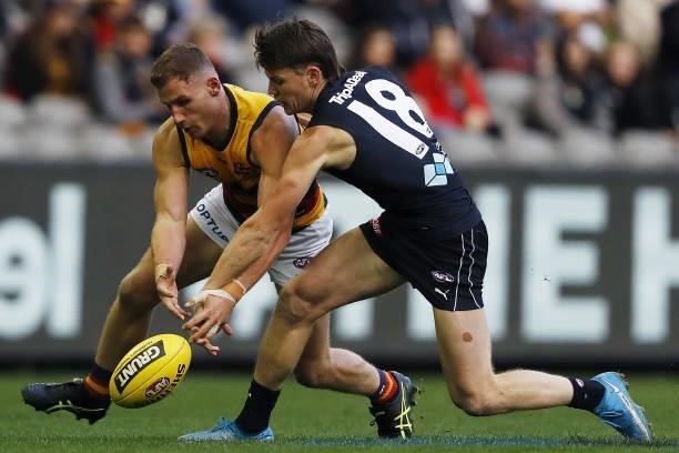 Rory Laird of the Crows and Sam Walsh of the Blues compete for the ball during the 2021 AFL Round 15 match between the Carlton Blues and the Adelaide...