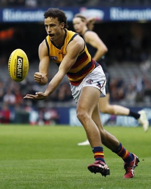 Will Hamill of the Crows handpasses the ball during the 2021 AFL Round 15 match between the Carlton Blues and the Adelaide Crows at Marvel Stadium on...