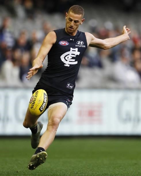 Liam Jones of the Blues kicks the ball during the 2021 AFL Round 15 match between the Carlton Blues and the Adelaide Crows at Marvel Stadium on June...