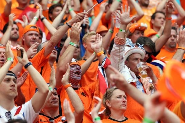 Netherlands' supporters cheer for their team before the UEFA EURO 2020 round of 16 football match between the Netherlands and the Czech Republic at...