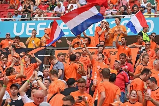 Netherlands supporters cheer before the UEFA EURO 2020 round of 16 football match between the Netherlands and the Czech Republic at Puskas Arena in...