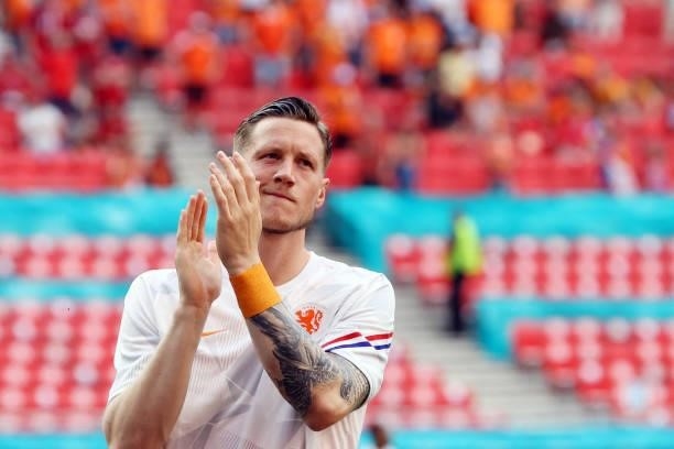 Netherlands' forward Wout Weghorst applauds as he enters the pitch to warm up before the UEFA EURO 2020 round of 16 football match between the...