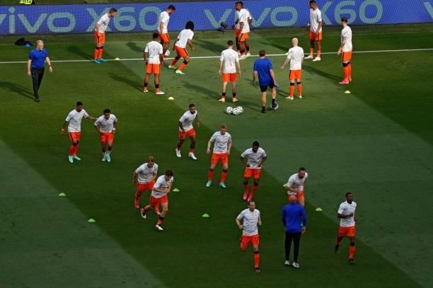 Netherlands' players warm up prior to the UEFA EURO 2020 round of 16 football match between the Netherlands and the Czech Republic at Puskas Arena in...