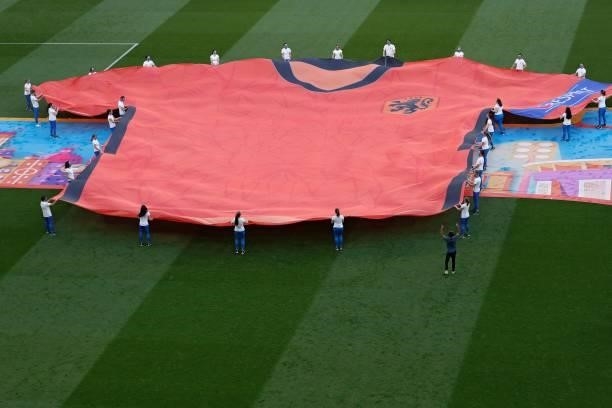 Performers display a bannner depicting Netherlands' jersey on the pitch before the UEFA EURO 2020 round of 16 football match between the Netherlands...