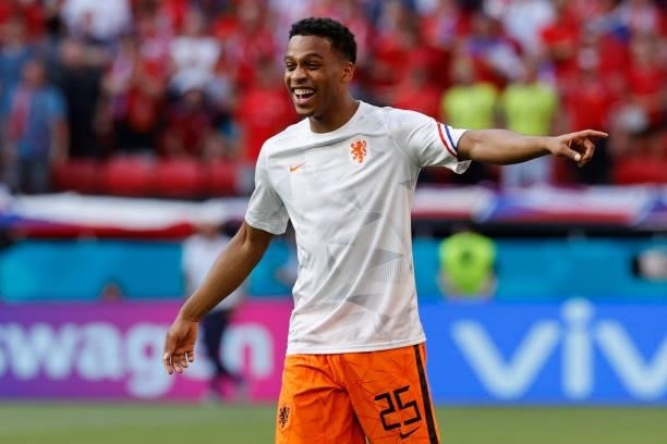 Netherlands' midfielder Jurrien Timber laughs as he warms up before the UEFA EURO 2020 round of 16 football match between the Netherlands and the...