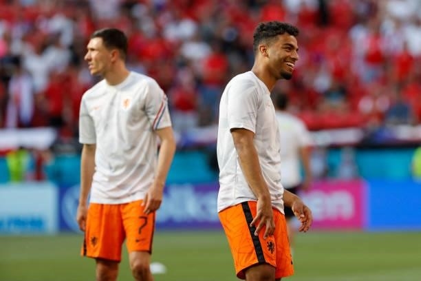 Netherlands' defender Owen Wijndal laughs as he warms up before the UEFA EURO 2020 round of 16 football match between the Netherlands and the Czech...