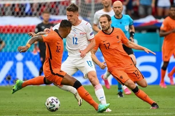 Czech Republic's forward Patrik Schick fights for the ball with Netherlands' defender Patrick van Aanholt and Netherlands' defender Daley Blind...