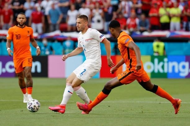 Netherlands' defender Denzel Dumfries challenges Czech Republic's defender Pavel Kaderabek during the UEFA EURO 2020 round of 16 football match...