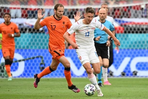 Netherlands' defender Daley Blind and Czech Republic's midfielder Lukas Masopust fights for the ball during the UEFA EURO 2020 round of 16 football...
