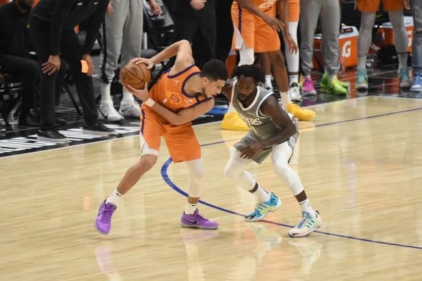 Patrick Beverley of the LA Clippers plays defense on Devin Booker of the Phoenix Suns during Game 4 of the Western Conference Finals of the 2021 NBA...