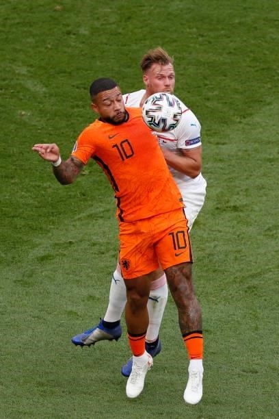 Netherlands' forward Memphis Depay fights for the ball with Czech Republic's defender Tomas Kalas during the UEFA EURO 2020 round of 16 football...