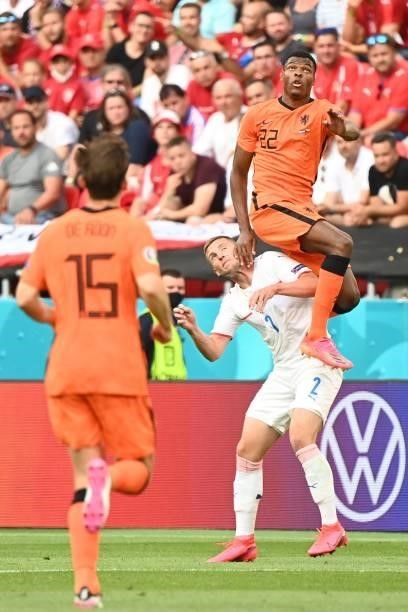 Czech Republic's defender Pavel Kaderabek and Netherlands' defender Denzel Dumfries jump for the ball during the UEFA EURO 2020 round of 16 football...