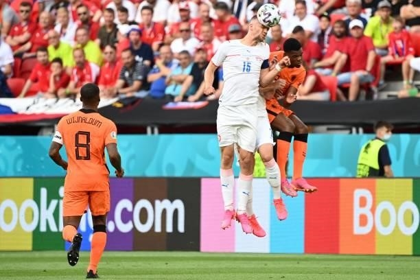 Czech Republic's midfielder Tomas Soucek jumps for the ball with Netherlands' defender Denzel Dumfries during the UEFA EURO 2020 round of 16 football...