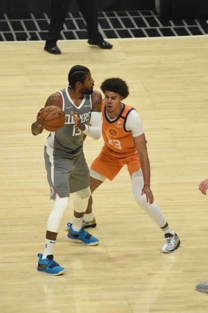 Cameron Johnson of the Phoenix Suns plays defense on Paul George of the LA Clippers during Game 4 of the Western Conference Finals of the 2021 NBA...