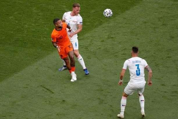 Netherlands' forward Memphis Depay fights for the ball with Czech Republic's defender Tomas Kalas during the UEFA EURO 2020 round of 16 football...