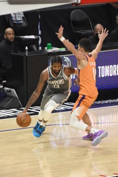 Devin Booker of the Phoenix Suns plays defense on Paul George of the LA Clippers during Game 4 of the Western Conference Finals of the 2021 NBA...