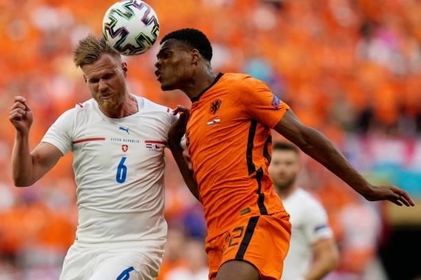 Netherlands' defender Denzel Dumfries heads the ball with Czech Republic's defender Tomas Kalas during the UEFA EURO 2020 round of 16 football match...