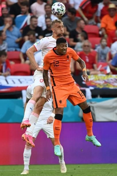 Netherlands' defender Patrick van Aanholt fights for the ball with Czech Republic's midfielder Tomas Soucek during the UEFA EURO 2020 round of 16...