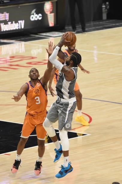 Paul George of the LA Clippers shoots the ball over Chris Paul of the Phoenix Suns during Game 4 of the Western Conference Finals of the 2021 NBA...