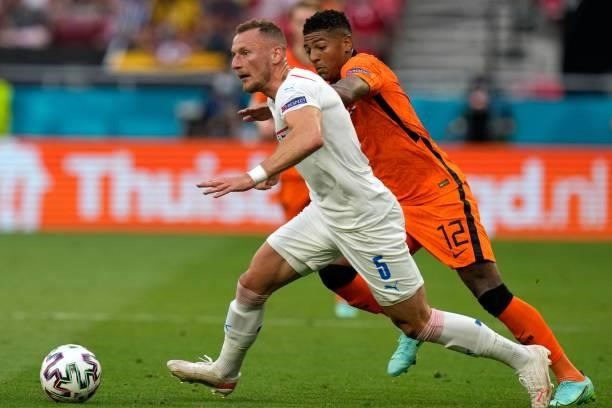 Netherlands' defender Patrick van Aanholt challenges Czech Republic's defender Vladimir Coufal during the UEFA EURO 2020 round of 16 football match...