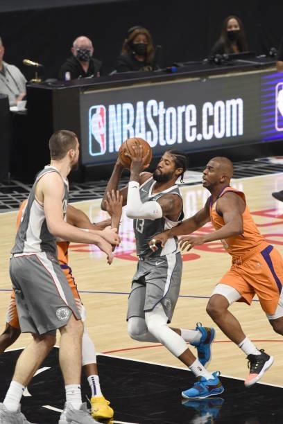 Paul George of the LA Clippers drives to the basket against the Phoenix Suns during Game 4 of the Western Conference Finals of the 2021 NBA Playoffs...