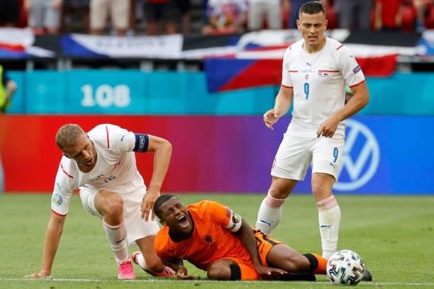Czech Republic's midfielder Tomas Soucek fouls Netherlands' midfielder Georginio Wijnaldum next to Czech Republic's midfielder Tomas Holes during the...