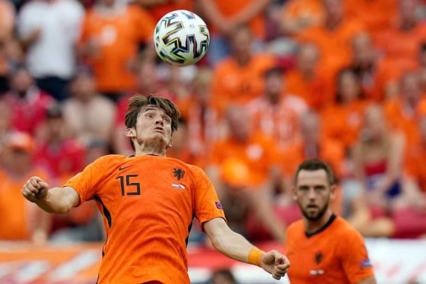 Netherlands' midfielder Marten de Roon heads the ball during the UEFA EURO 2020 round of 16 football match between the Netherlands and the Czech...