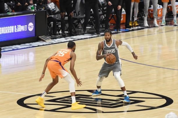 Mikal Bridges of the Phoenix Suns plays defense on Paul George of the LA Clippers during Game 4 of the Western Conference Finals of the 2021 NBA...