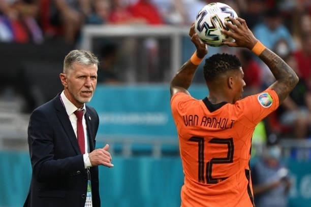 Czech Republic's coach Jaroslav Silhavy reacts as Netherlands' defender Patrick van Aanholt throws-in from the touchline during the UEFA EURO 2020...