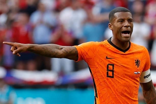Netherlands' midfielder Georginio Wijnaldum wearing a captain's armband bearing the words "One Love