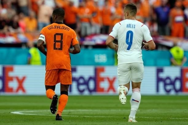 Netherlands' midfielder Georginio Wijnaldum and Czech Republic's midfielder Tomas Holes run during the UEFA EURO 2020 round of 16 football match...