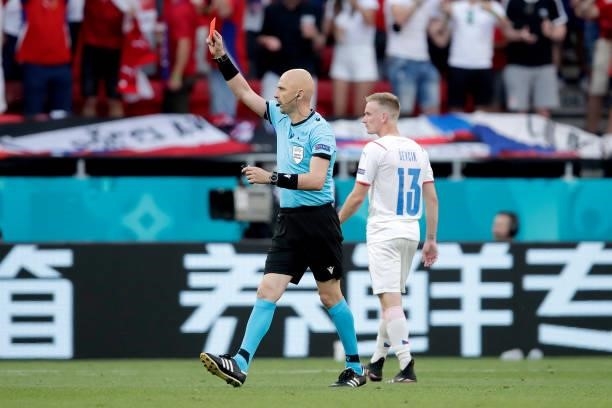 Referee Sergei Karasev gives Matthijs de Ligt of Holland a red card during the EURO match between Holland v Czech Republic at the Puskas Arena on...
