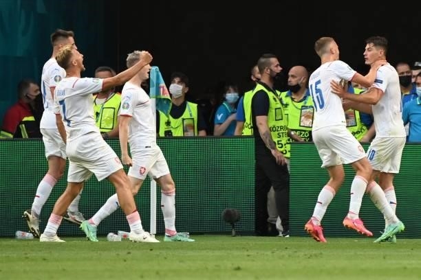 Czech Republic's forward Patrik Schick celebrates with teammates after scoring his team's second goal during the UEFA EURO 2020 round of 16 football...
