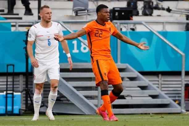 Netherlands' defender Denzel Dumfries reacts next to Czech Republic's defender Vladimir Coufal during the UEFA EURO 2020 round of 16 football match...
