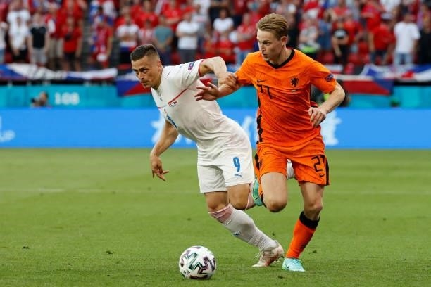 Netherlands' midfielder Frenkie de Jong challenges Czech Republic's midfielder Tomas Holes during the UEFA EURO 2020 round of 16 football match...