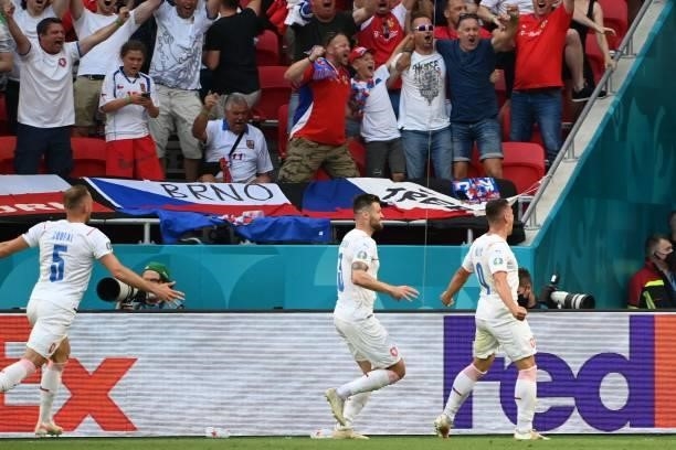 Czech Republic's midfielder Tomas Holes celebrates after scoring his team's first goal during the UEFA EURO 2020 round of 16 football match between...