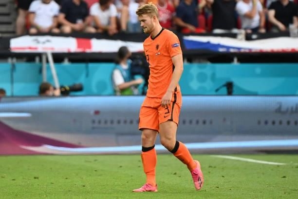 Netherlands' defender Matthijs de Ligt walks off after being given a red card for a handball during the UEFA EURO 2020 round of 16 football match...