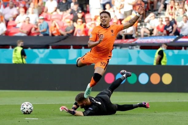 Donyell Malen of Holland, Tomas Vaclik of Czech Republic during the EURO match between Holland v Czech Republic at the Puskas Arena on June 27, 2021...