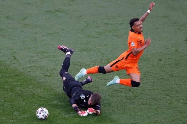 Netherlands' forward Donyell Malen fights for the ball with Czech Republic's goalkeeper Tomas Vaclik during the UEFA EURO 2020 round of 16 football...