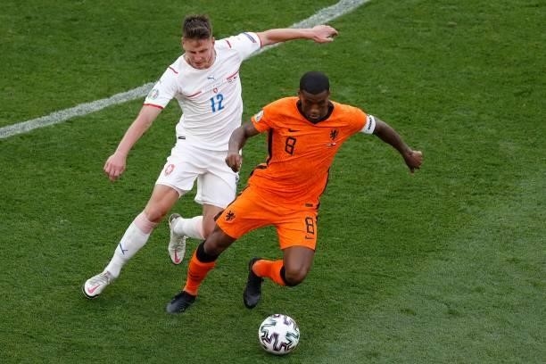 Czech Republic's midfielder Lukas Masopust fights for the ball with Netherlands' midfielder Georginio Wijnaldum during the UEFA EURO 2020 round of 16...