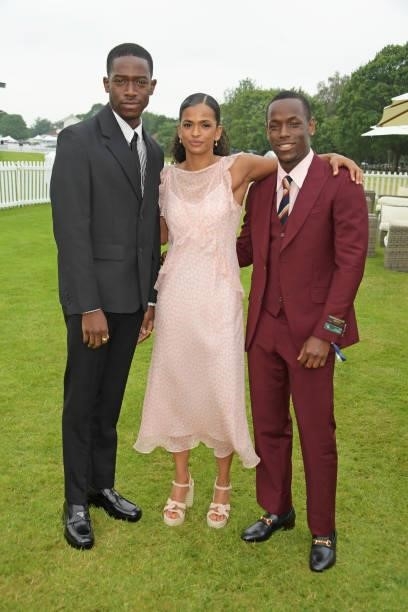 Damson Idris, Ramla Ali and Micheal Ward attend the Cartier Queen's Cup Polo 2021 at Guards Polo Club on June 27, 2021 in Egham, England.