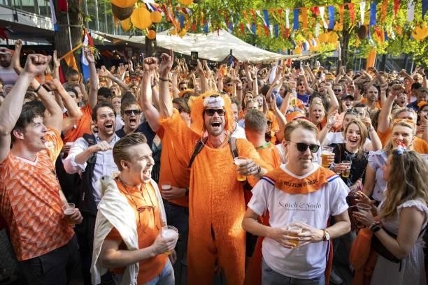 Football fans react as they watch the UEFA EURO 2020 round of 16 football match between the Netherlands and the Czech Republic in Amsterdam, the...