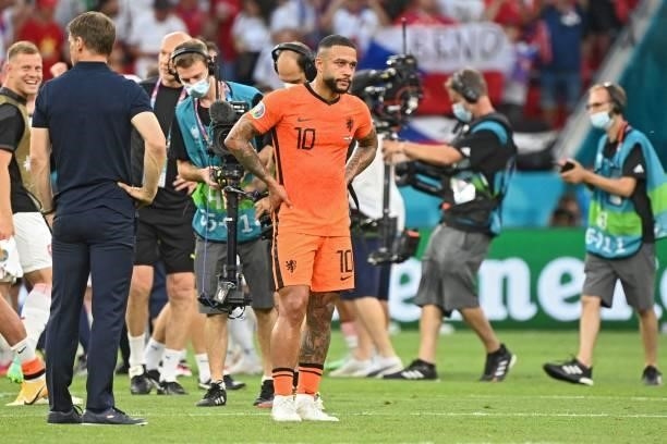 Netherlands' forward Memphis Depay reacts after losing during the UEFA EURO 2020 round of 16 football match between the Netherlands and the Czech...