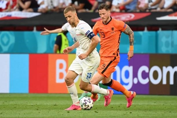 Czech Republic's midfielder Tomas Soucek fights for the ball with Netherlands' forward Wout Weghorst during the UEFA EURO 2020 round of 16 football...