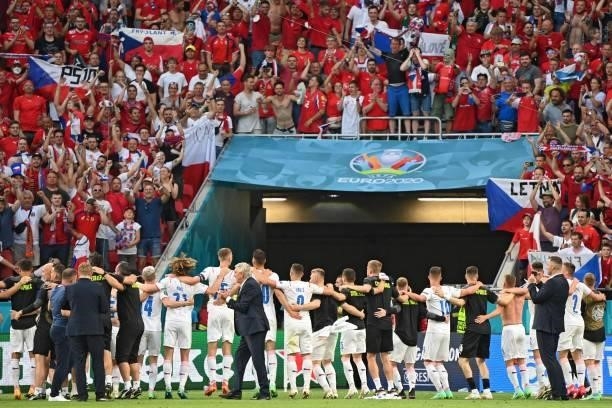 Czech Republic's players celebrate with supporters after winning the UEFA EURO 2020 round of 16 football match between the Netherlands and the Czech...