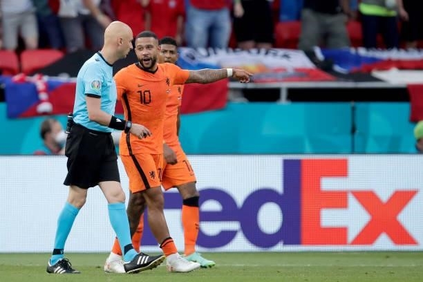 Referee Sergei Karasev, Memphis Depay of Holland during the EURO match between Holland v Czech Republic at the Puskas Arena on June 27, 2021 in...
