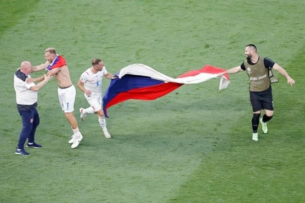 Czech Republic's defender Vladimir Coufal and Czech Republic's goalkeeper Tomas Koubek hold their national flag as they celebrate winning the UEFA...