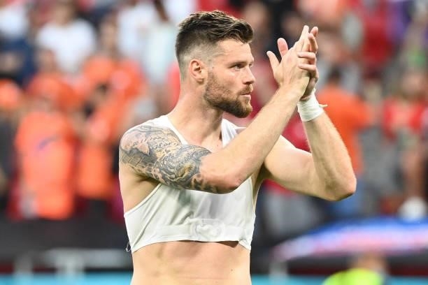 Czech Republic's defender Ondrej Celustka celebrates after winning the UEFA EURO 2020 round of 16 football match between the Netherlands and the...