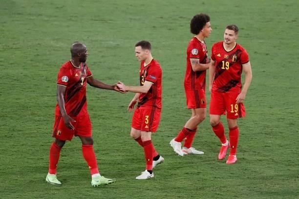 Belgium's players celebrate after winning the UEFA EURO 2020 round of 16 football match between Belgium and Portugal at La Cartuja Stadium in Seville...