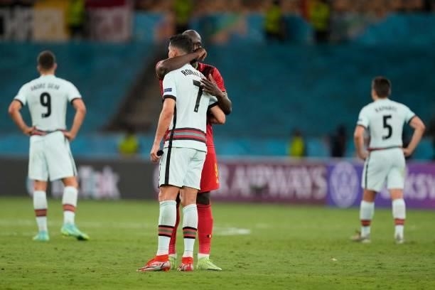 Belgium's forward Romelu Lukaku whispers to Portugal's forward Cristiano Ronaldo at the end of the UEFA EURO 2020 round of 16 football match between...